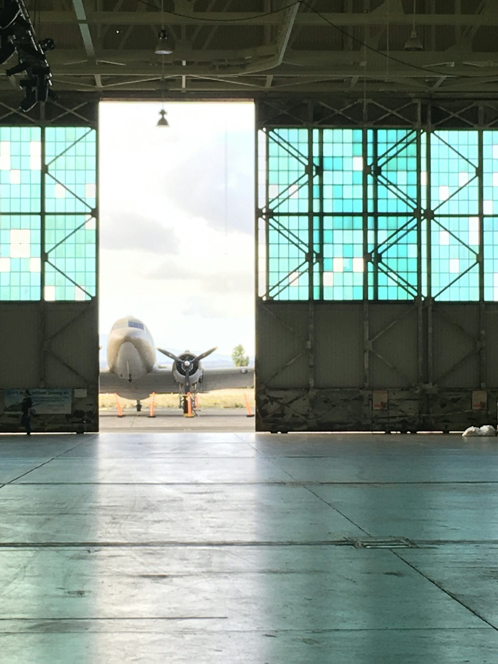 Aircraft seen through the doors of a hangar